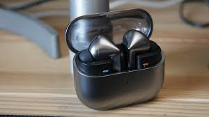 best mobile accessories 2025 wireless earbuds on table, mobile accessories, best mobile accessories, top 10 mobile accessories, smartphone accessories in Pakistan, must-have phone accessories