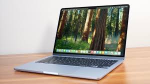Apple MacBook Air 13-inch M4 open on a wooden table, Cutting-edge laptops